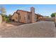 The house has desert landscaping, a covered patio, and a chimney at 3215 E Constance Way, Phoenix, AZ 85042