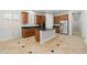 Open concept kitchen featuring a center island, stainless appliances, and dark granite countertops at 3215 E Constance Way, Phoenix, AZ 85042