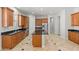 Spacious kitchen with a large island, stainless steel appliances, and granite countertops at 3215 E Constance Way, Phoenix, AZ 85042