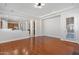 Bright and spacious living area with hardwood floors, neutral paint, and an exterior door at 3215 E Constance Way, Phoenix, AZ 85042