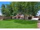 Expansive backyard with patio and lawn, perfect for relaxing and entertaining outdoors at 3911 W Quail Ave, Glendale, AZ 85308