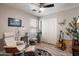 Relaxing bedroom area featuring comfortable seating, natural light, and modern decor at 3911 W Quail Ave, Glendale, AZ 85308