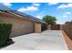 Long driveway leading to property; features solar panels and a private gate at 3911 W Quail Ave, Glendale, AZ 85308