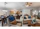 Cozy living room with tile floors open to the kitchen and dining areas at 3911 W Quail Ave, Glendale, AZ 85308