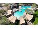 Breathtaking aerial view of the pools and patio surrounded by shaded lounge areas at 3935 E Rough Rider Rd # 1066, Phoenix, AZ 85050
