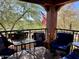 Serene balcony with outdoor seating, views of nature, and decorative patriotic accents at 3935 E Rough Rider Rd # 1066, Phoenix, AZ 85050