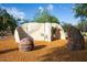 Modern community climbing structure made of stone with wood chip base at 3935 E Rough Rider Rd # 1066, Phoenix, AZ 85050