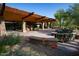Community center with covered outdoor seating and stone columns at 3935 E Rough Rider Rd # 1066, Phoenix, AZ 85050