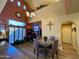 Dining area next to an office, with high ceilings, stone walls, and wood floors at 3935 E Rough Rider Rd # 1066, Phoenix, AZ 85050