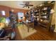 Large home office featuring extensive built-in bookshelves and a comfortable workspace at 3935 E Rough Rider Rd # 1066, Phoenix, AZ 85050