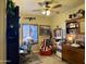 A home office is complete with a desk, chair, window, and decorations at 3935 E Rough Rider Rd # 1066, Phoenix, AZ 85050