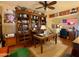 Spacious home office with built-in shelving, natural light, and a classic desk setup at 3935 E Rough Rider Rd # 1066, Phoenix, AZ 85050