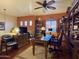 Cozy home office with a dark wood desk, bookshelves, and a view to the exterior at 3935 E Rough Rider Rd # 1066, Phoenix, AZ 85050