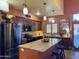 Modern kitchen featuring granite counters, stainless steel appliances, and breakfast bar at 3935 E Rough Rider Rd # 1066, Phoenix, AZ 85050