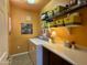 Laundry room features a white washer and dryer, counter space and storage shelves at 3935 E Rough Rider Rd # 1066, Phoenix, AZ 85050