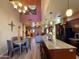 Open concept living room featuring kitchen, dining, and living space with high ceilings at 3935 E Rough Rider Rd # 1066, Phoenix, AZ 85050