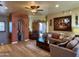 Comfortable living room featuring a ceiling fan, hardwood floors, and cozy seating arrangement at 3935 E Rough Rider Rd # 1066, Phoenix, AZ 85050