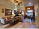 Spacious open-concept featuring wood floors, comfortable seating, and dining area at 3935 E Rough Rider Rd # 1066, Phoenix, AZ 85050