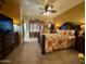 A primary bedroom suite features a bed with nightstands and access to the backyard at 3935 E Rough Rider Rd # 1066, Phoenix, AZ 85050