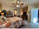 A primary bedroom suite features a bed with nightstands, a tv and an ensuite bathroom at 3935 E Rough Rider Rd # 1066, Phoenix, AZ 85050