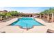 Relaxing swimming pool with several lounge chairs and poolside cabana, surrounded by mature trees at 3935 E Rough Rider Rd # 1066, Phoenix, AZ 85050