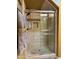Tiled stand-up shower features glass doors, and a rain shower fixture at 3935 E Rough Rider Rd # 1066, Phoenix, AZ 85050