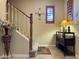 Carpeted staircase with wood railing leads to the upper level of the home at 3935 E Rough Rider Rd # 1066, Phoenix, AZ 85050