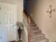 Carpeted staircase leads to the upper level of the home at 3935 E Rough Rider Rd # 1066, Phoenix, AZ 85050