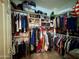 A fully organized walk-in closet provides ample storage for clothing and accessories at 3935 E Rough Rider Rd # 1066, Phoenix, AZ 85050