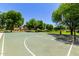 Outdoor basketball court surrounded by lush greenery in a well-maintained community at 4072 E Windsor Dr, Gilbert, AZ 85296