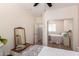 Bedroom featuring a ceiling fan and a closet, plus a dresser with a mirror and decor at 4072 E Windsor Dr, Gilbert, AZ 85296