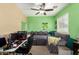 Bright bedroom features a ceiling fan, decorative pillows, green walls, and a window for light at 4072 E Windsor Dr, Gilbert, AZ 85296
