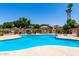 Sparkling community pool surrounded by a well-maintained deck and lush landscaping at 4072 E Windsor Dr, Gilbert, AZ 85296