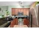 Modern kitchen with stainless steel appliances, granite countertops and natural light at 4072 E Windsor Dr, Gilbert, AZ 85296