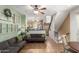 Open-concept living area with neutral walls, a comfortable sofa and a staircase at 4072 E Windsor Dr, Gilbert, AZ 85296
