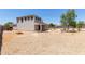 Spacious backyard with a gravel landscape, enhancing its low-maintenance appeal and outdoor potential at 42098 W Balsa Dr, Maricopa, AZ 85138