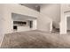 View of a Gathering room with stairs leading to the second floor and the kitchen in the background at 42098 W Balsa Dr, Maricopa, AZ 85138