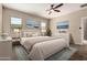 Stylishly furnished main bedroom with large bed, bedside tables, and tasteful decor at 42098 W Balsa Dr, Maricopa, AZ 85138