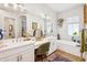 Bright bathroom features double sinks, a vanity area, modern fixtures, and a soaking tub at 4215 E Ronald St, Gilbert, AZ 85295