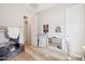 Bright bedroom with wood-look floors, ample closet space, and neutral wall color at 4215 E Ronald St, Gilbert, AZ 85295