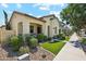 Charming single-story home featuring a welcoming porch and neat landscaping, enhancing its curb appeal at 4215 E Ronald St, Gilbert, AZ 85295