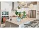 Modern kitchen with granite countertops, stainless steel appliances, and contemporary lighting fixtures at 4215 E Ronald St, Gilbert, AZ 85295