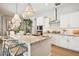 Stylish kitchen featuring an island with granite countertops, stainless steel appliances, and modern lighting at 4215 E Ronald St, Gilbert, AZ 85295