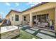 Outdoor patio includes a fire pit and a covered area with comfortable seating at 4215 E Ronald St, Gilbert, AZ 85295