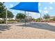 Community playground featuring a climbing structure over a sand area at 4215 E Ronald St, Gilbert, AZ 85295