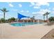Community pool offers a large swimming area with lounge chairs, surrounded by palm trees at 4215 E Ronald St, Gilbert, AZ 85295