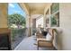 Inviting front porch with seating area offering a relaxing outdoor space with charming architectural details at 4215 E Ronald St, Gilbert, AZ 85295