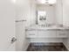 Stylish bathroom featuring a large mirror and marble countertop sink at 4312 E Roma Ave, Phoenix, AZ 85018
