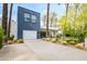 Striking home exterior showcases modern design, xeriscaped yard, and private driveway at 4312 E Roma Ave, Phoenix, AZ 85018