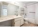 This bathroom features a white vanity and a shower/tub combination at 4414 S Ventura Dr, Tempe, AZ 85282